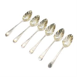 Set of six George III Old English pattern dessert spoons, each with fluted gilded bowls an...