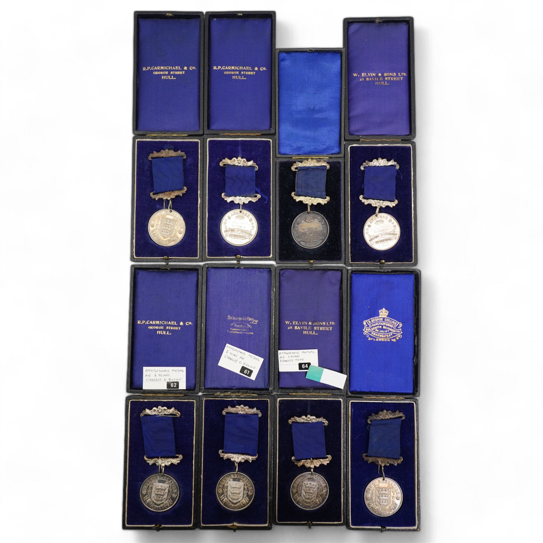 Eight Hull Education Committee 'Perfect Attendance At School' hallmarked silver medallions, each housed in a fitted case