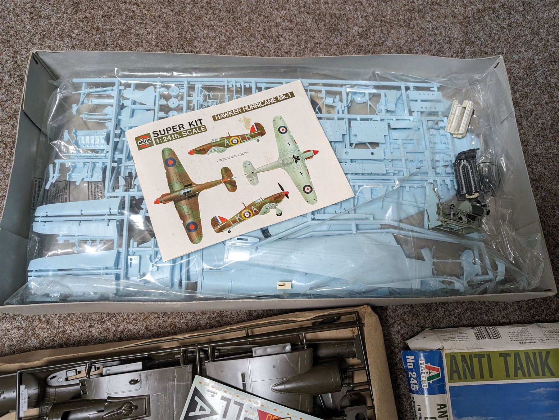 Three model kits, including Airfix Hawker Hurricane MK1 1:24 scale, Italeri Anti Tank Dodge 1:35 scale and Monogram Visible B-17 1:48 scale, all boxed 