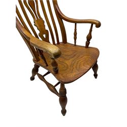 Late 19th century elm and ash comb-back Windsor chair, shaped back with pierced vase-shaped central splat and spindle supports, shaped saddle seat raised on turned supports united by H-stretcher