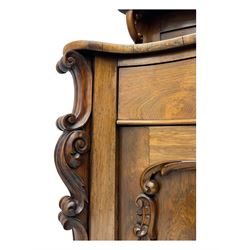 Mid-19th century rosewood chiffonier, raised back with scroll and leaf carved shaped pediment, serpentine top over drawer and double cupboard with scrollwork decoration, on shaped plinth base