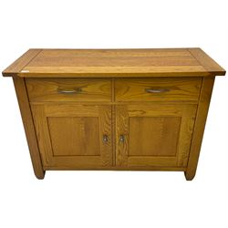 Oak side cabinet, fitted with two drawers and two panelled doors