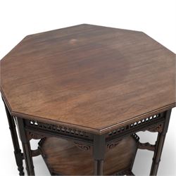 Late 19th to early 20th century mahogany octagonal centre table, moulded top over pierced arcade frieze rails and fretwork brackets, on eight cluster column supports terminating to turned feet, united by under tier with raised gallery 