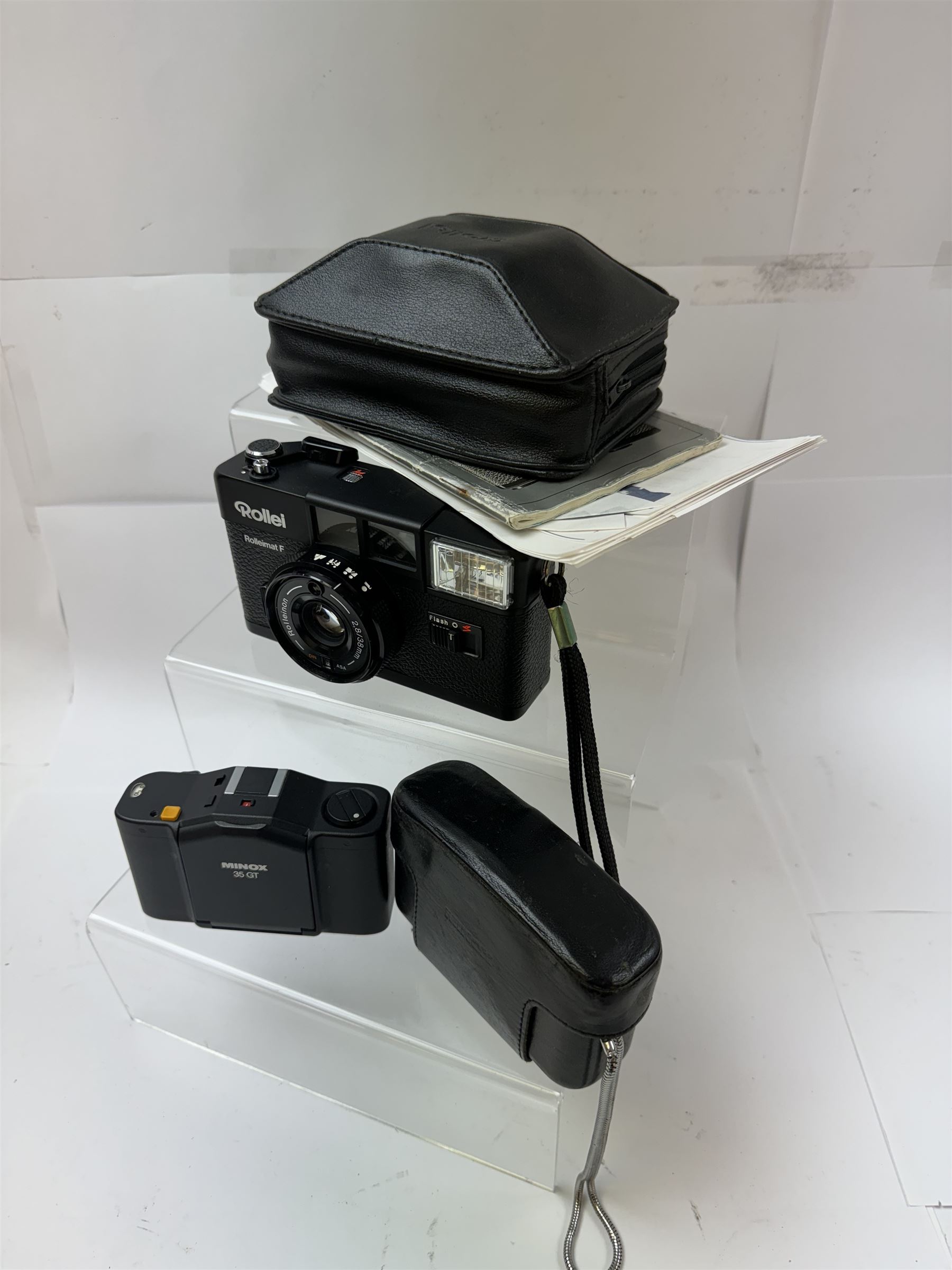 Minox 35GT film camera, together with a Rollei Rolleimat F 355 compact film camera serial no. 049650188, with a Rolleinon 2.8/38mm lens, both with original cases and instruction booklets