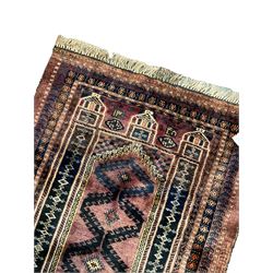 Persian prayer purple ground, decorated with three pointed buildings over tailing lozenge patterned field (111cm x 82cm); and a small Persian rug or mat, overall geometric design (81cm x 56cm)