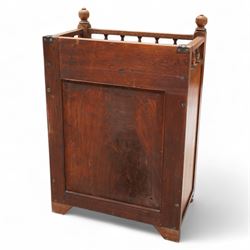 Late 19th century Aesthetic Movement walnut cupboard, raised and pierced spindle gallery surmounted by ring-turned finials, over a panelled door decorated with central foliate carved panel and surrounded by plain geometric shaped panels, applied with brass fittings and loop handle, on turned feet