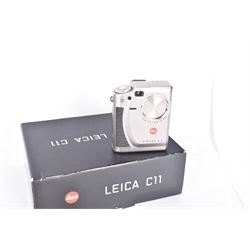 Leica C11 APS film compact camera, in silver and chrome finish, serial no. 2636834, in original clear hard case and box, with instruction booklet, together with a Leica Digilux 4.3, with 1:2.8-4.5/8.3-24.9mm lens, serial no. 2598862, with instruction booklet