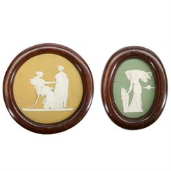 Two Wedgwood Jasperware plaques, to include an oval green example depicting a woman harves...