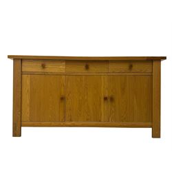 Contemporary oak sideboard, rectangular top with central contrasting plank, over three frieze drawers and three cupboards with enclosed shelving, on rectangular stile supports