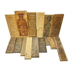 Collection of 20th century beech and other hardwood Dutch folk art Speculaasplank or biscuit moulds, most examples typically carved with figures in traditional dress, tallest H52cm