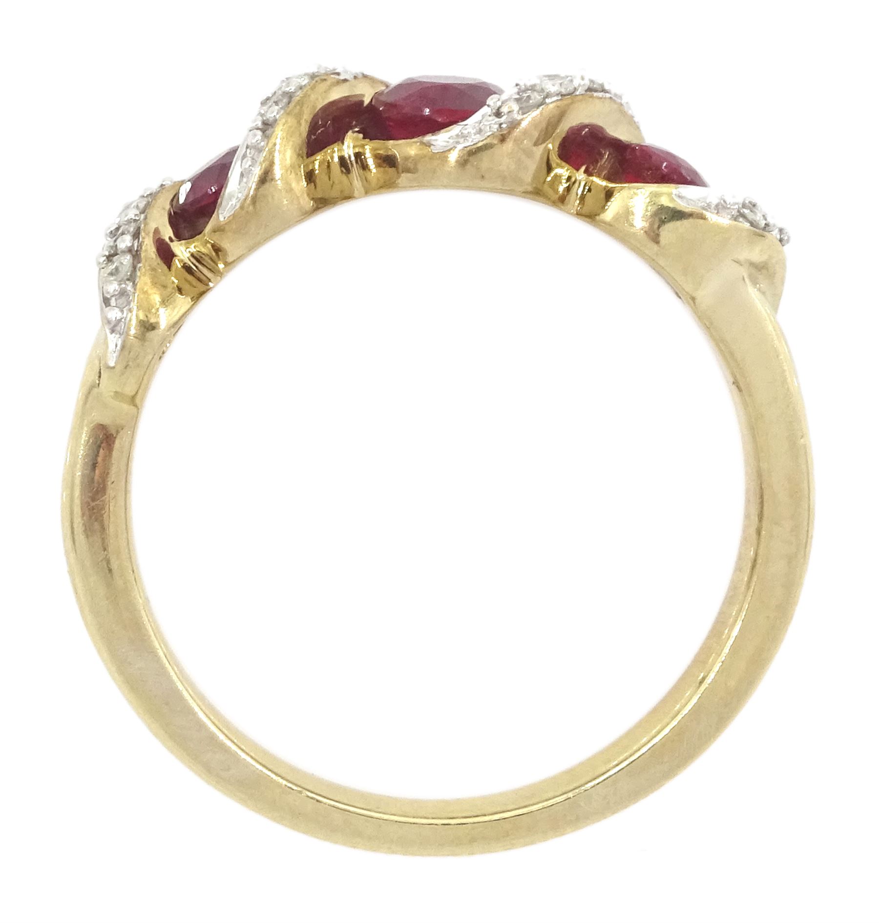 9ct gold three stone ruby and diamond crossover ring, hallmarked