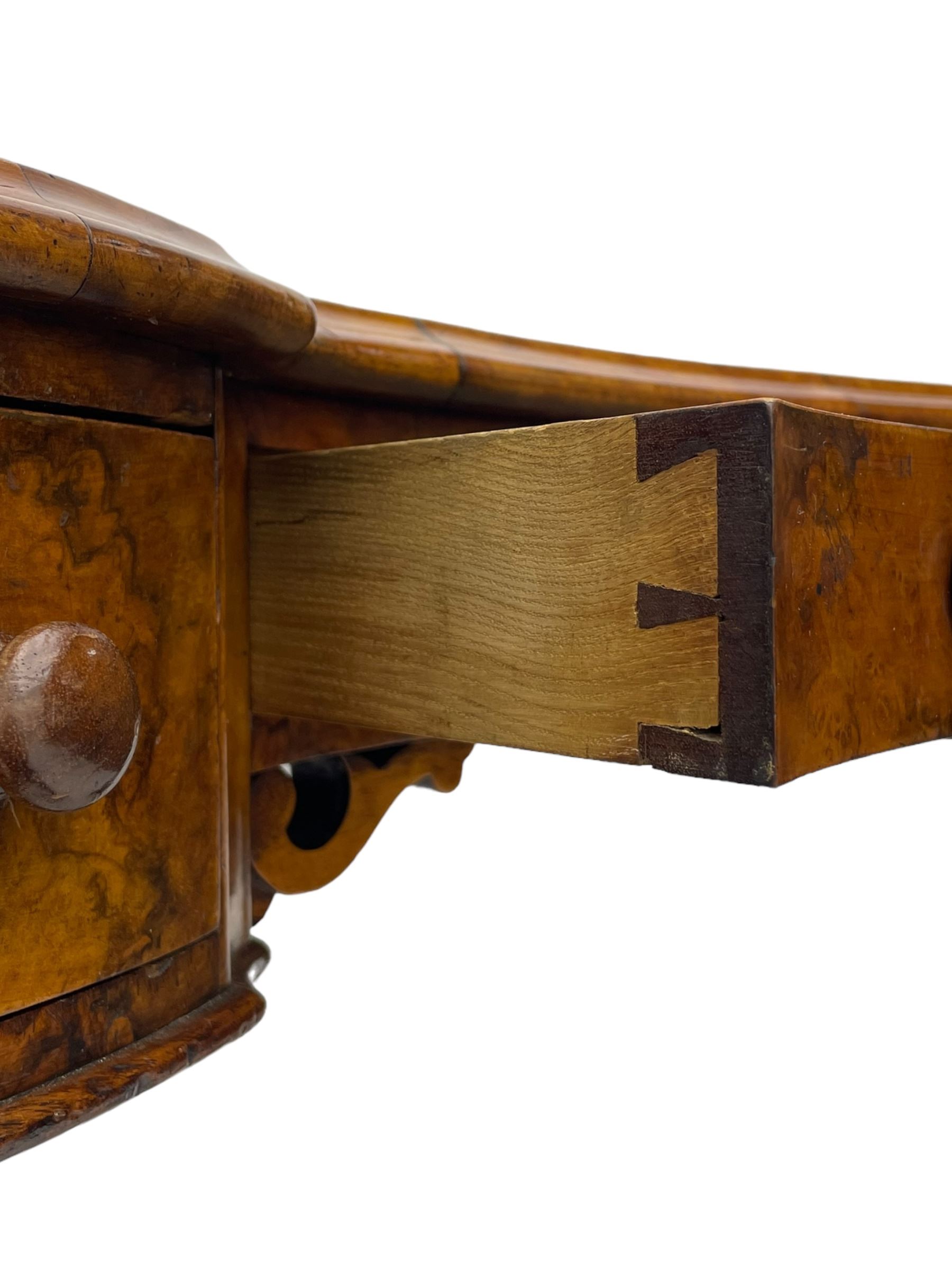 Victorian walnut kidney-shaped writing desk, moulded top with floral cast brass gallery and inset leather writing surface, fitted with three frieze drawers with turned handles, shaped and pierced end supports on raised platforms terminating to splayed feet, united by twist turned and lobe carved stretcher, brass and ceramic castors 