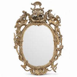 Early 19th century Rococo giltwood and gesso wall mirror, the frame decorated with curling...