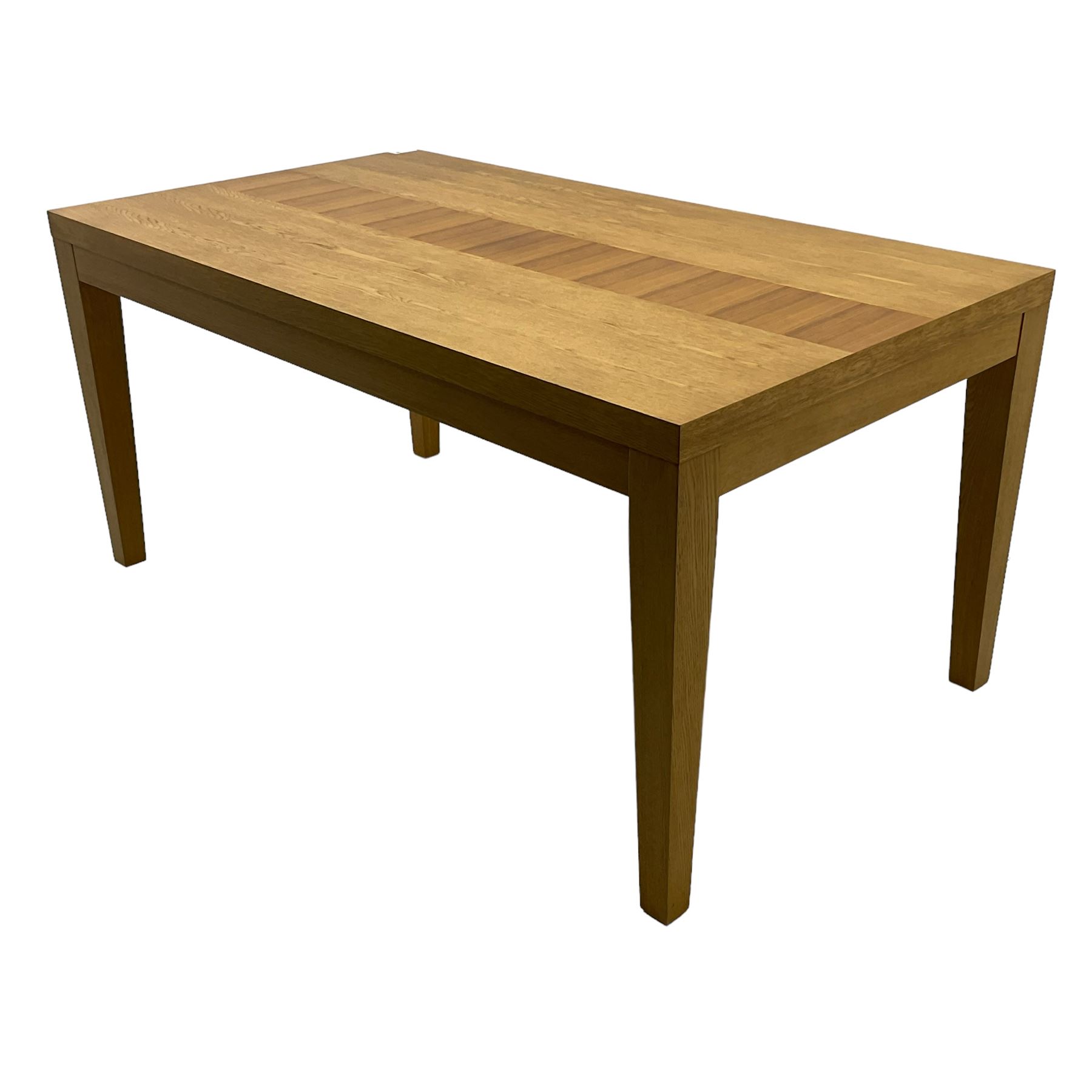 Contemporary oak dining table, rectangular top with inlaid walnut central strip, on square tapering supports 