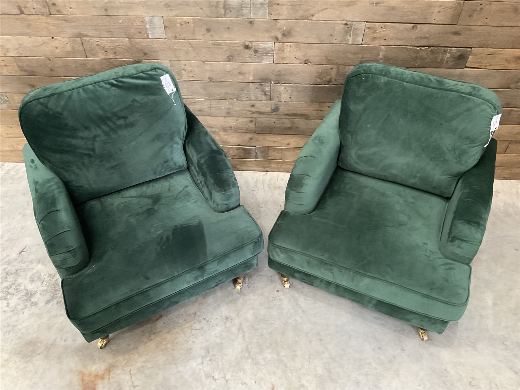 Pair of Howard design armchairs, upholstered in jade green velvet fabric