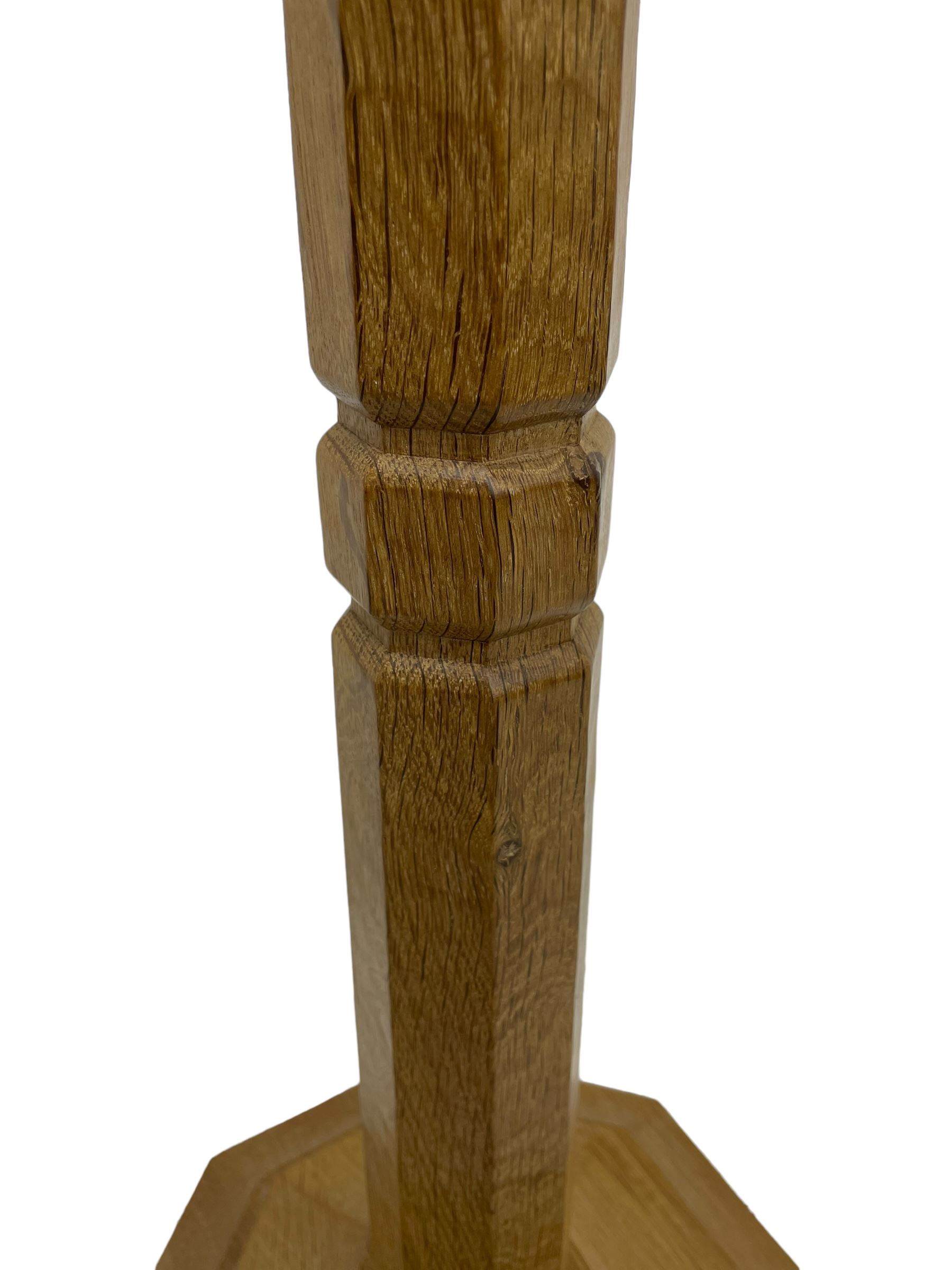 Mouseman - oak standard lamp, octagonal tapered stem on stepped and moulded octagonal base, carved with mouse signature, by the workshop of Robert Thompson, Kilburm 