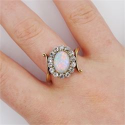 Early 20th century gold opal and milgrain set old cut diamond cluster ring, with twist scroll shoulders, stamped 18ct, total diamond weight approx 0.55 carat