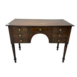 George III mahogany kneehole dressing or side table, moulded rectangular top over seven cock-beaded drawers, on ring turned support 