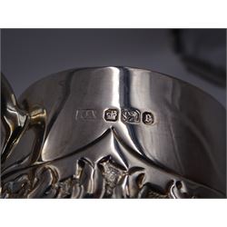 Late Victorian silver christening mug, with C handle and gilt interior, the body profusely embossed with floral and foliate decoration, hallmarked Atkin Brothers, Sheffield 1897, H10cm