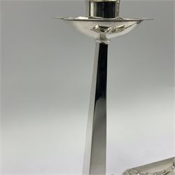 Pair of Arts & Crafts style silver plated candlesticks, by James Dixon & Sons, modeled after a design by Jan Eisenloeffel, each with square spreading base with strap-work detail, leading to a tapering square column with plain socket above a circular dished drip pan, each with makers mark, H22cm