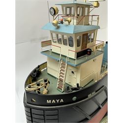 Modern model of American Coastal and River Tugboat 'Maya', in red, black and light blue finish, upon a green stand inscribed with name, H53cm, W52cm 