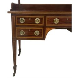 Edwardian inlaid mahogany kneehole dressing table, raised shaped oval bevelled mirror back, fitted with five drawers with banding and stringing, on square tapering supports with castors