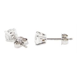 Pair of 18ct white gold round brilliant cut diamond stud earrings, stamped 750, total diamond weight 1.05 carat, with World Gemological Institute report