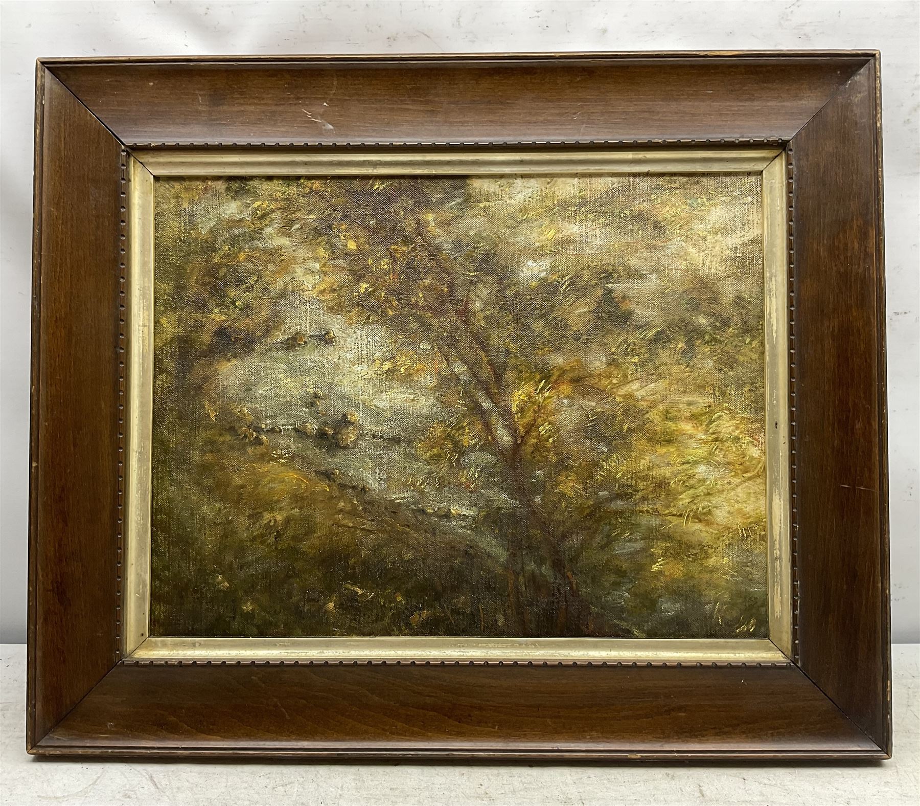 English School (Early 20th century): Wooded River Bank, oil on canvas laid on board unsigned 31cm x 41cm