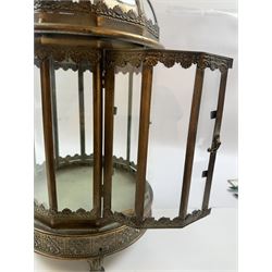 Pair of patinated brushed brass lanterns, of domed hexagonal form, with pierced gallery and swing handle, H63cm 


