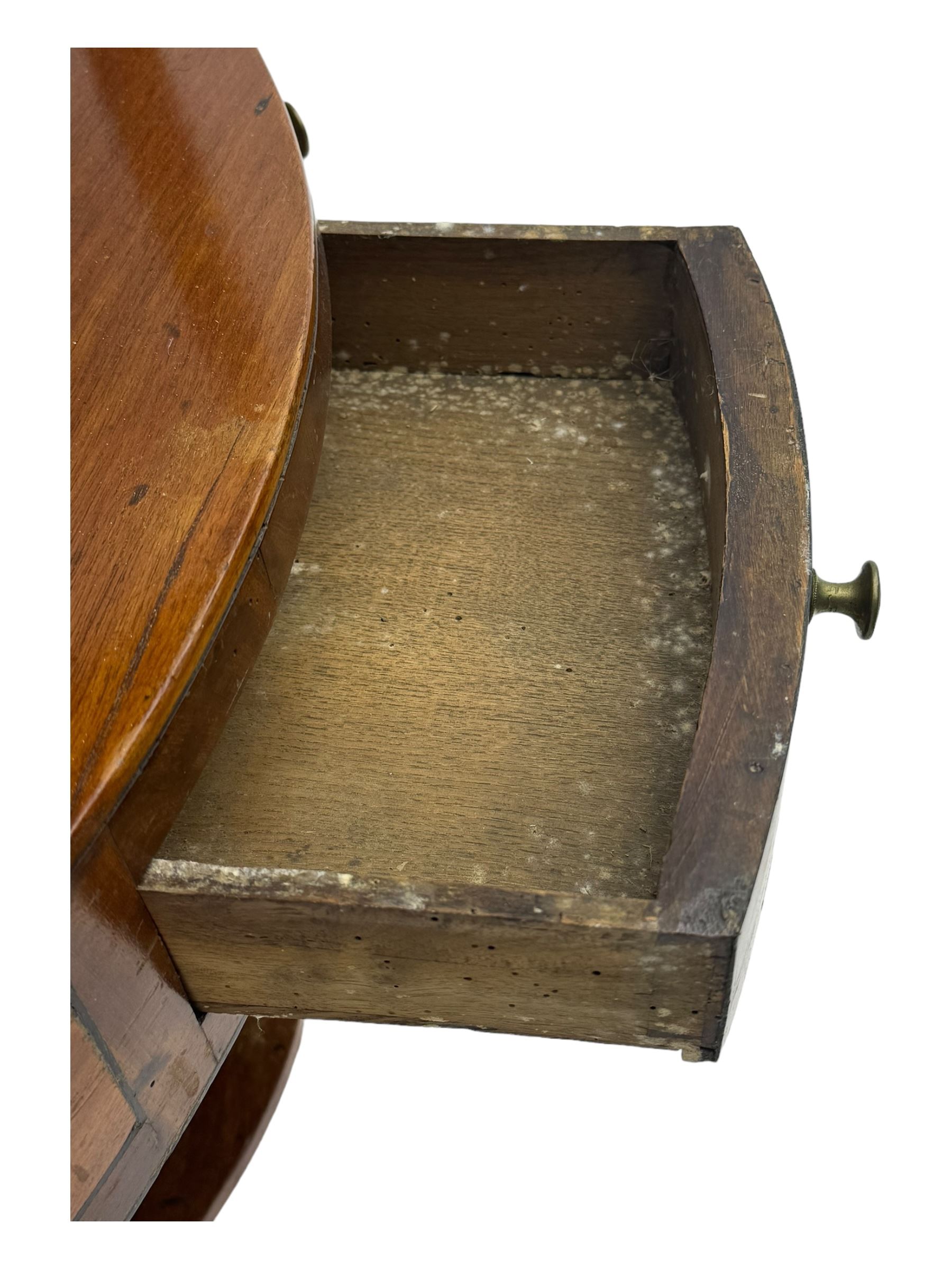 George III mahogany two-tier corner washstand, the inlaid top with geometric border, central drawer flanked by two faux drawers each with brass pull handle, on splayed supports united by shaped under-tier