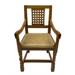 Rabbitman - set of six (5+1) oak dining chairs, pierced and carved lattice back, leather upholstered seat with stud band, on octagonal supports united by stretchers, carved with rabbit signature, by Peter Heap of Wetwang 