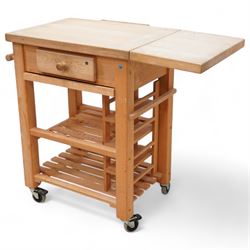 Late 20th century beech kitchen preparation trolley, rectangular drop-leaf butcher's block top, fitted with single drawer and knife slots, over two slatted tiers, on castors