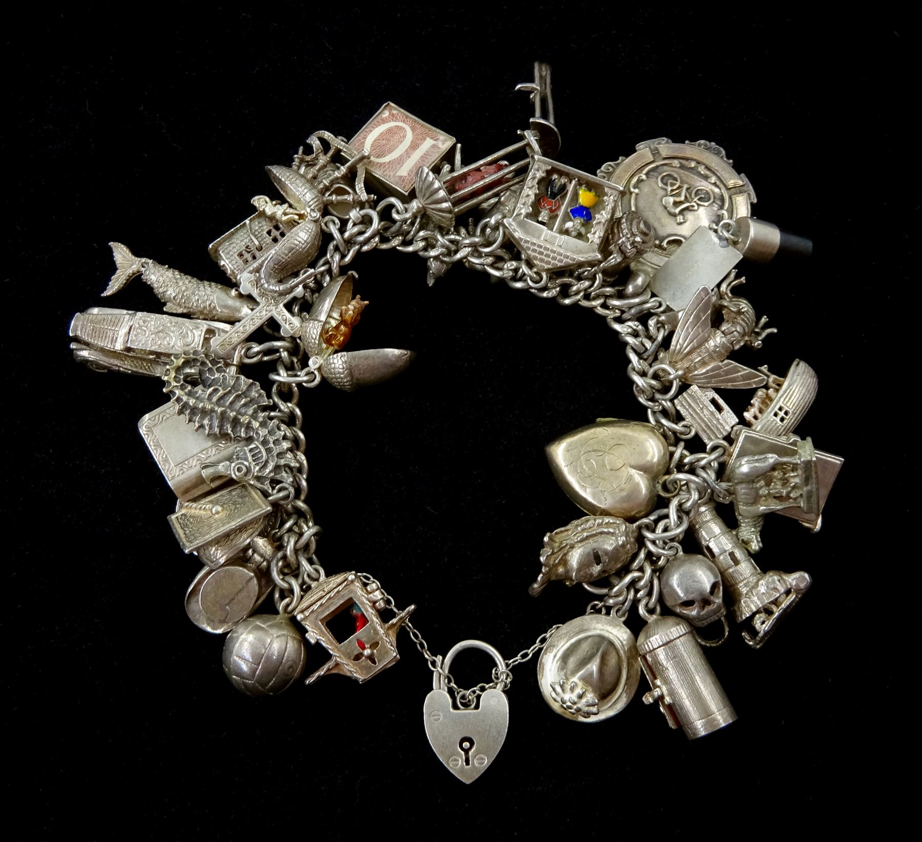 Sold at Auction: Sterling Silver Charm Bracelet