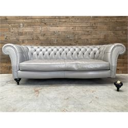 Three seat Chesterfield sofa, upholstered in grey buttoned leather - damaged leg