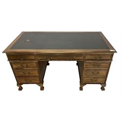 Georgian design twin pedestal desk, rectangular top with green leather inset, fitted with nine drawers, on cabriole supports with ball and claw feet 