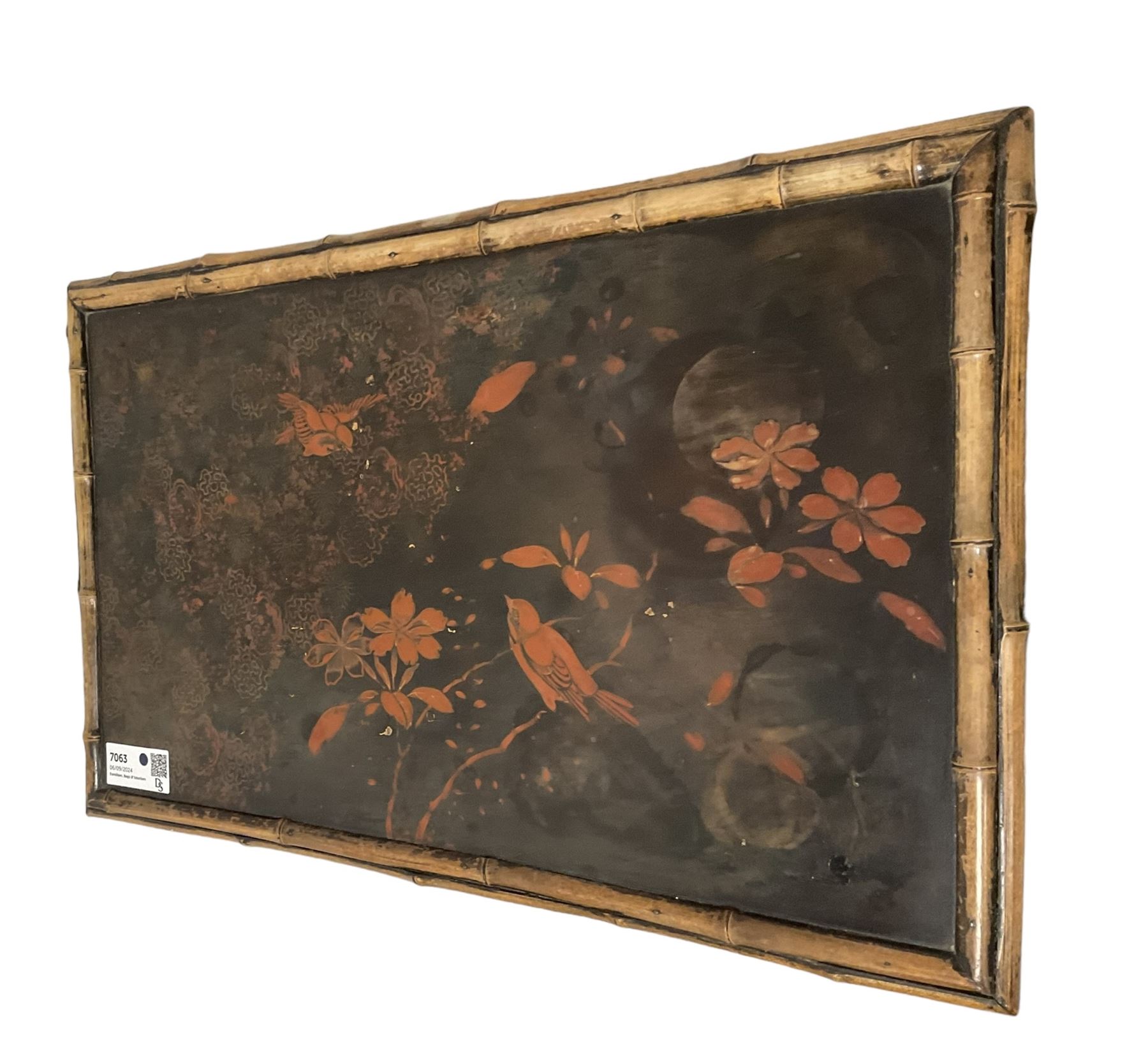 Late 19th century Aesthetic Movement lacquered and painted bamboo occasional table, rectangular top painted with Japanned traditional bird and blossom scenes, over two fold-out side leaves and undertier with pierced gallery apron