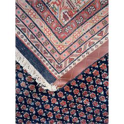 Large North-West Persian Arrak indigo ground carpet, the field decorated all-over with small Boteh motifs, multiple band border decorated with repeating geometric designs