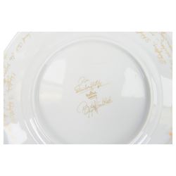 Rosenthal Die Zauberflote pattern dinner plate, designed by Von Bjorn Wiinblad, of circular form the gilt rim decorated in relief with stylised scene's from the Mozart opera,with opera reference inscriptions in German in gilt verso, with printed mark beneath, D32cm