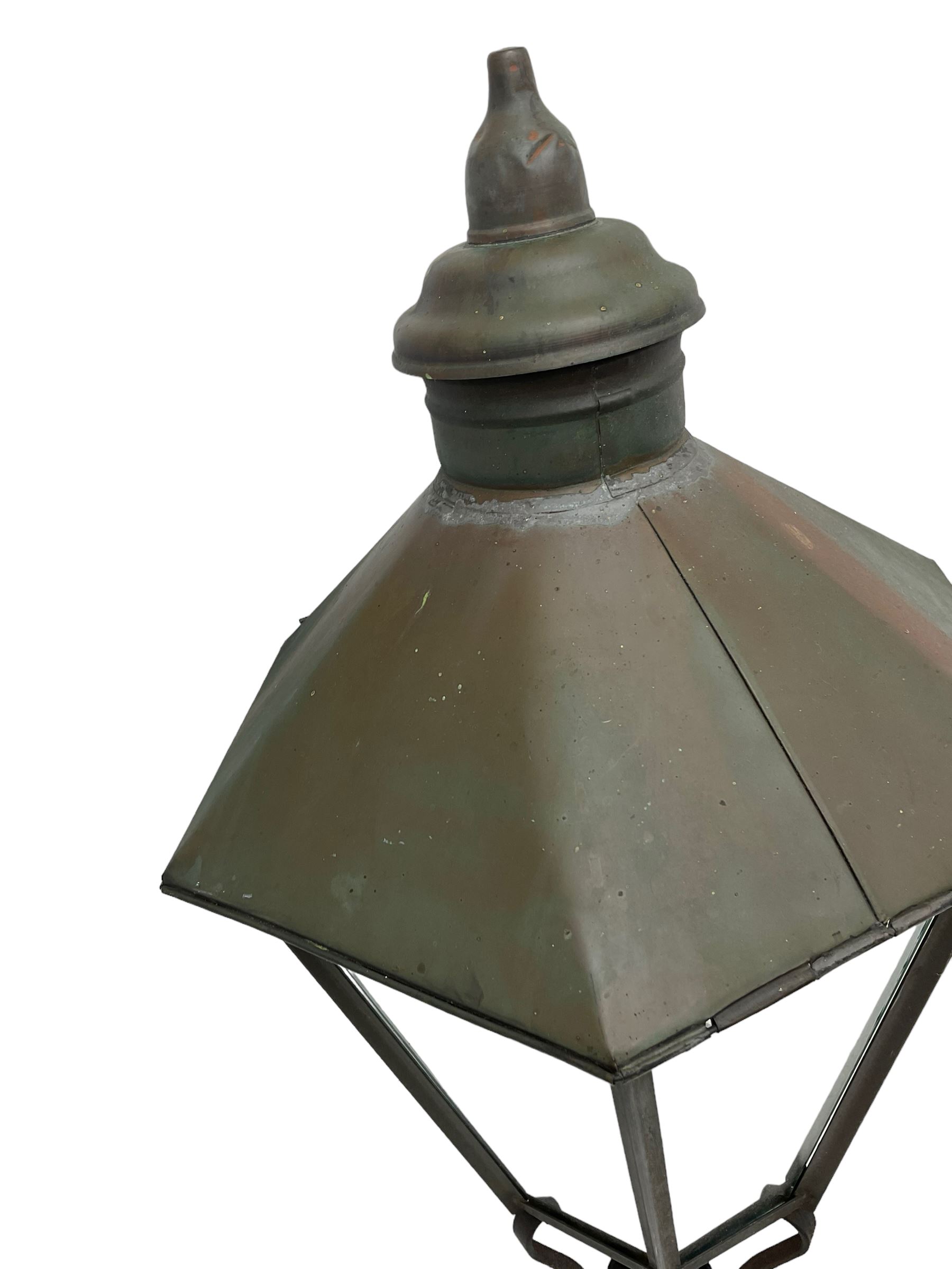 Victorian design six glass lantern, hexagonal tapered from with finial, scrolled lower supports on bracket