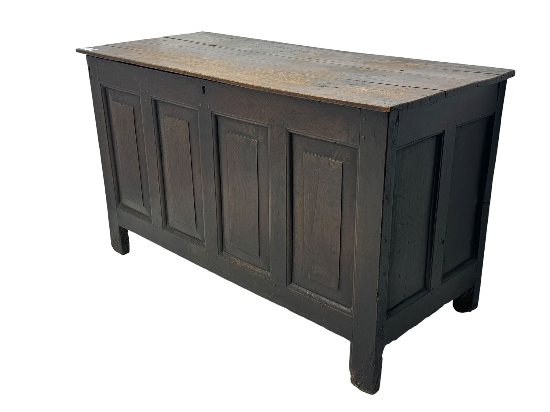 18th century oak coffer, rectangular plank lid over four panelled front and panelled sides, on stile supports 