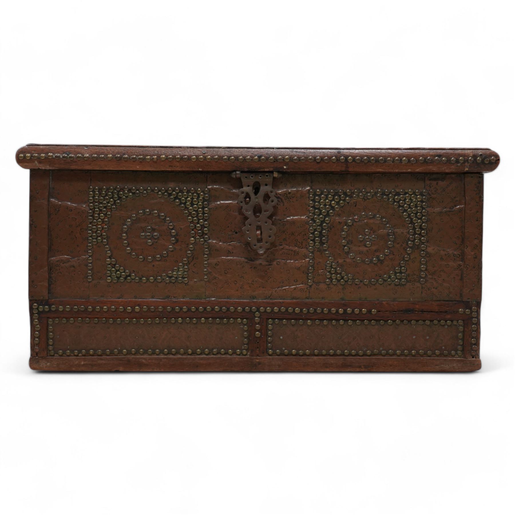 19th century Zanzibar teak and brass mounted chest, hinged lid enclosing divisions, the front decorated with studwork, carrying handles to each side 