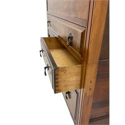 Edwardian walnut gentleman's tallboy, moulded hinged lid enclosing divisions, long drawer over two short drawers and panelled cupboard, turned supports terminating at ceramic castors