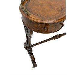 Victorian walnut kidney-shaped writing desk, moulded top with floral cast brass gallery and inset leather writing surface, fitted with three frieze drawers with turned handles, shaped and pierced end supports on raised platforms terminating to splayed feet, united by twist turned and lobe carved stretcher, brass and ceramic castors 