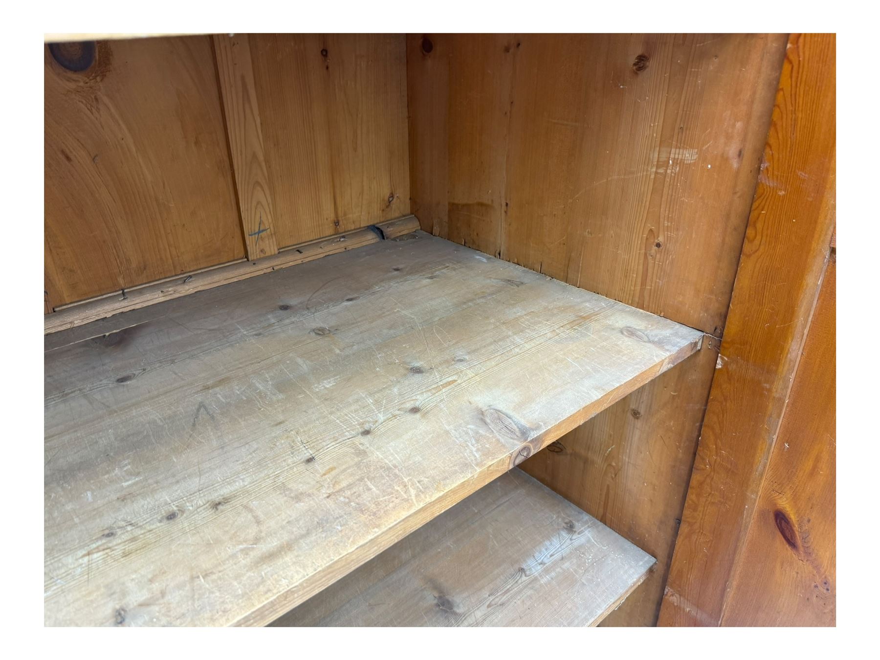 Large 19th century pine cupboard, rectangular top over two panelled later doors, enclosing four open shelves, on plinth base