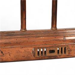 Victorian copper club fender, leather upholstered cushioned seats on turned balustrade supports, drop centre with C-scroll corner brackets, on stepped moulded curb 