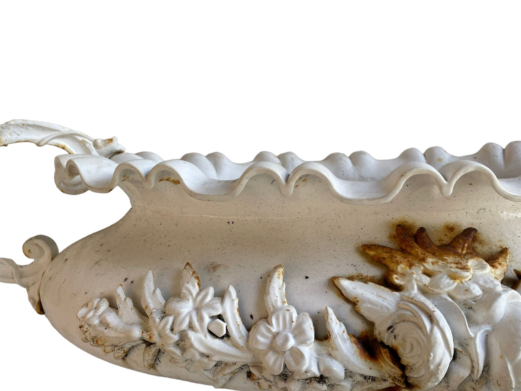 Corneau Alfred á Charleville - mid-19th century French cast iron planter, swollen and waisted oval form with scalloped upper rim, scrolled and ivy leaf cast handles, the front mounted by extending floral casting, on oval footed base with foliage and paw cast feet, the interior with drainage holes, inscribed 'Corneau Alfred á Charleville No 3' 