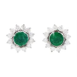 Pair of 18ct white gold emerald and round brilliant cut diamond cluster stud earrings, stamped, total emerald weight approx 0.90 carat, total diamond weight approx 0.65 carat