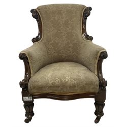 William IV mahogany framed armchair, rolled back with scroll carved uprights, acanthus carved arm terminals over serpentine fronted seat, raised on turned and lobe carved supports with castors