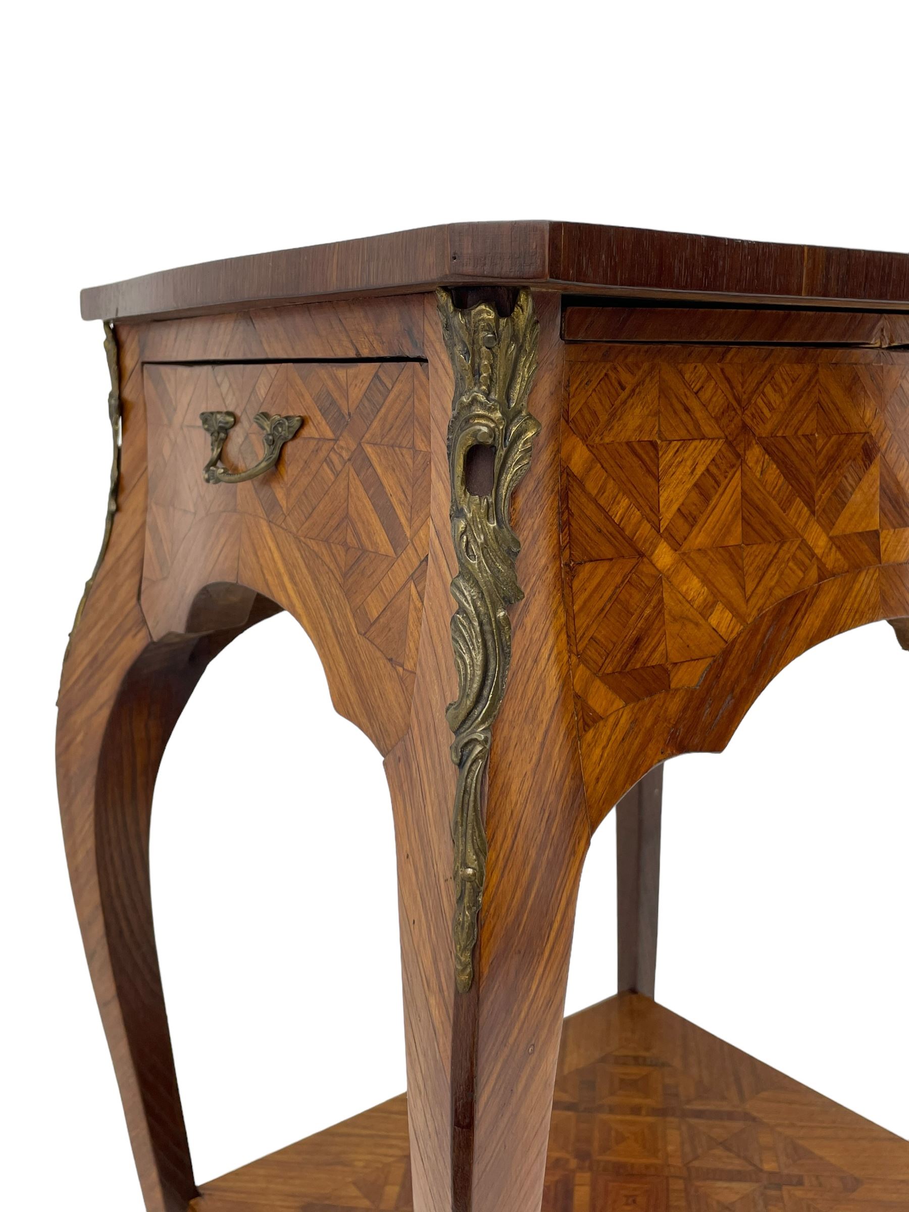 Late 20th century French design Kingwood lamp table, shaped form with geometric parquetry inlaid top within band and raised lip, fitted with single drawer and slide, on cabriole supports united by undertier, decorated with ornate cast gilt metal mounts and terminal caps 