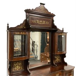 Late Victorian inlaid rosewood mirror back sideboard, shaped cresting rail decorated with scrolling foliate ivorine inlays, over rectangular bevelled mirror, flanked by bow-front glazed cupboards over inlaid 'green man' motifs, the base fitted with single drawer and cylindrical cupboards flanking a mirror panelled cupboard, on square tapering supports